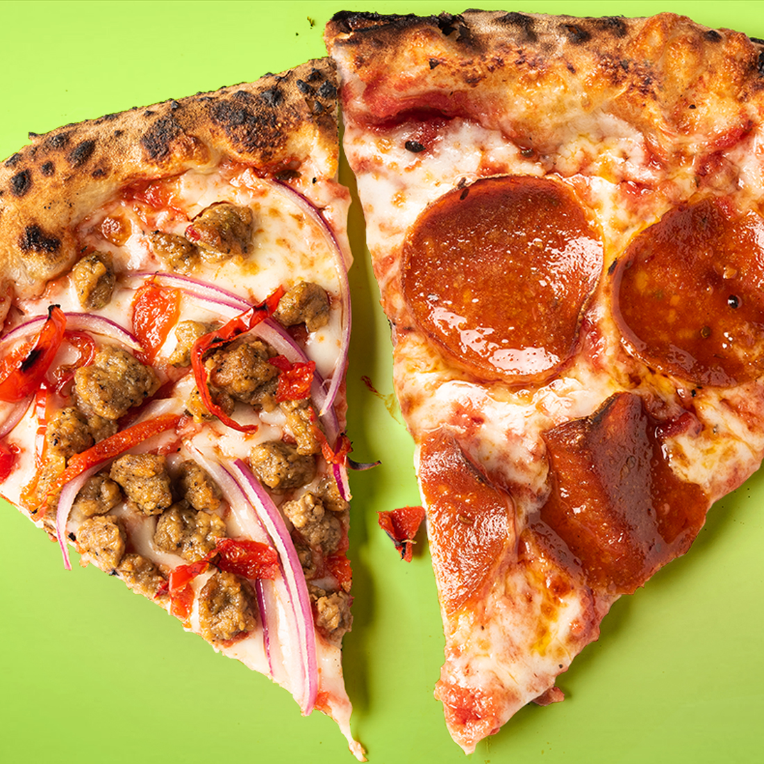 Two slices of pizza with plant-based toppings on a green gradient background