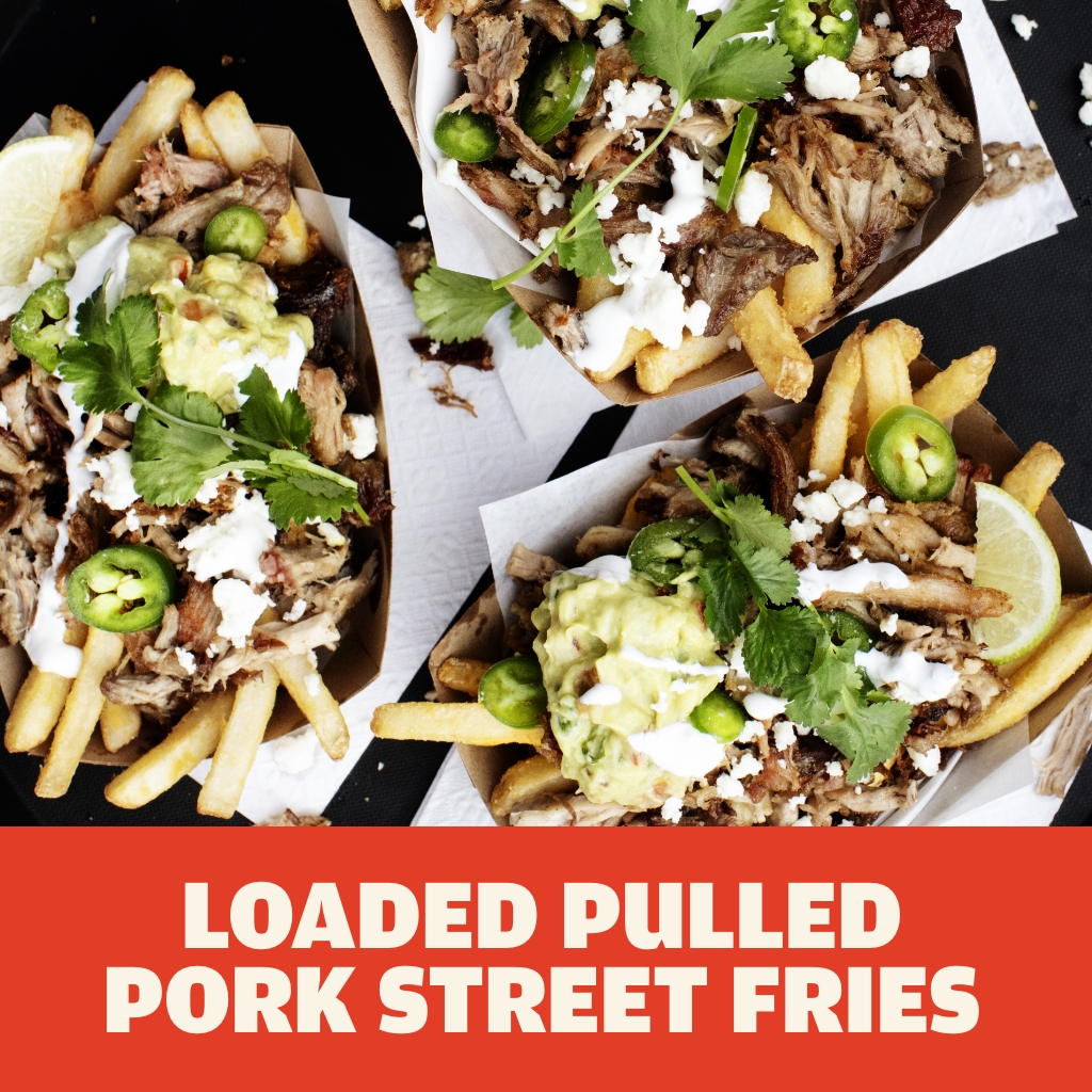 AUSTIN BLUES Hardwood Pulled Pork street fries with cheese, guacamole, cilantro, fresh jalapeños and lime wedges served in paper boats.