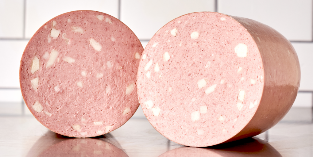 a loaf of mortadella cut in half