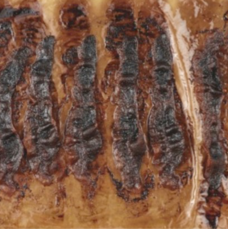 burnt bacon on a tray