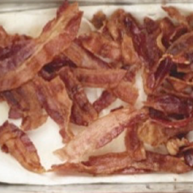 broken bacon on a tray