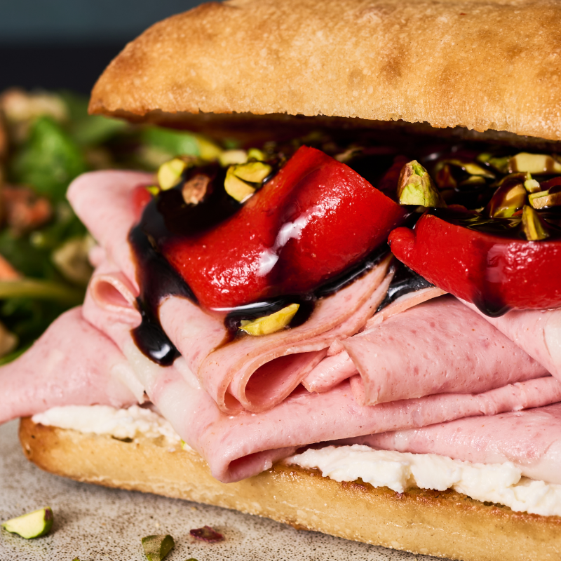 close-up of a mortadella ricotta sandwich