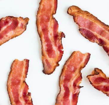 Half slices of Hormel Bacon 1 on white background