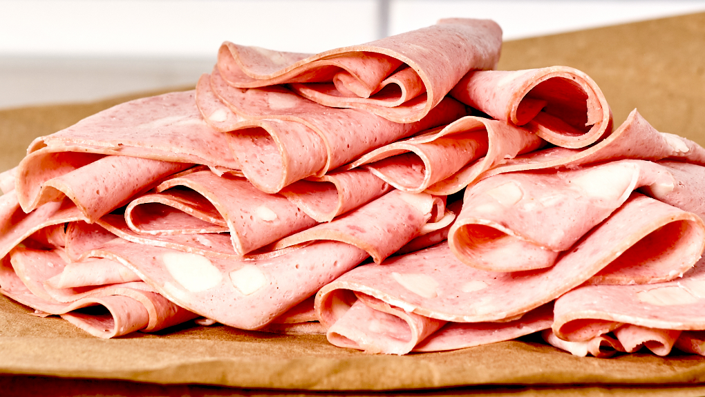 Sliced mortadella on a tray