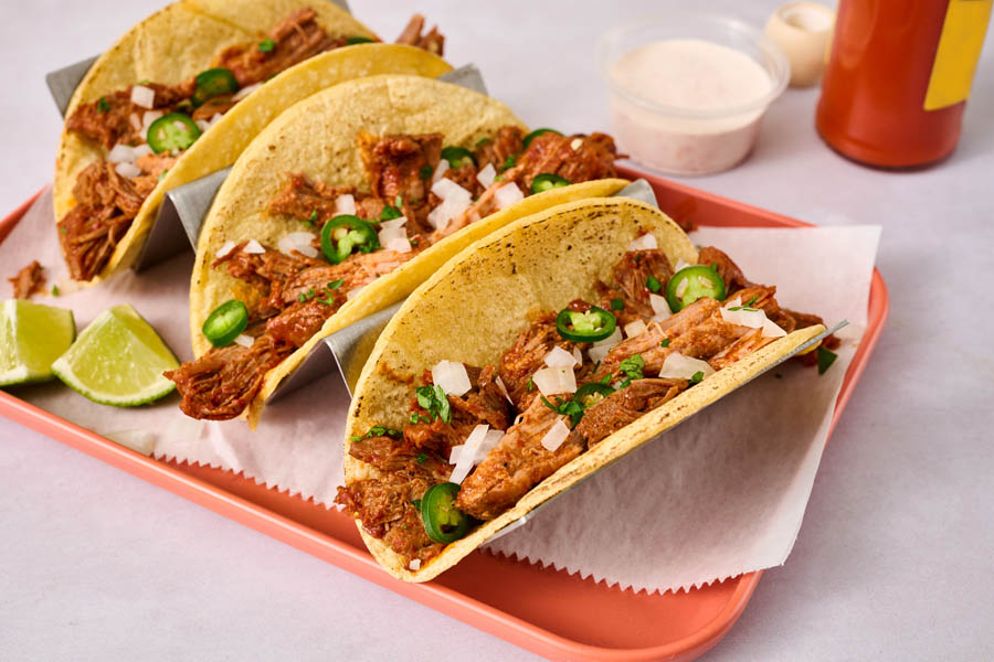 Pot roast barbacoa tacos on an orange tray